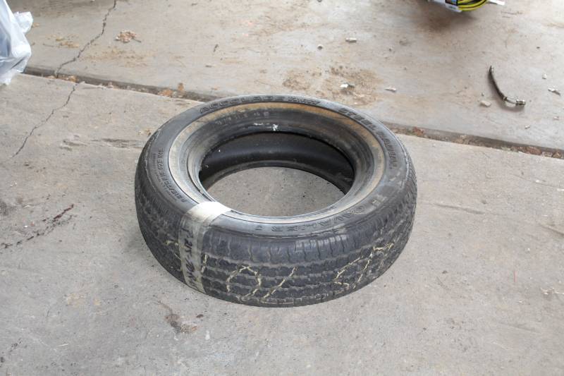 lot 14 image: Acolade Touring Edition P21570R15 Whitewall Tire