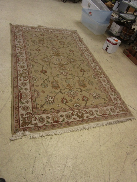 lot 217 image: FRINGED AREA RUG