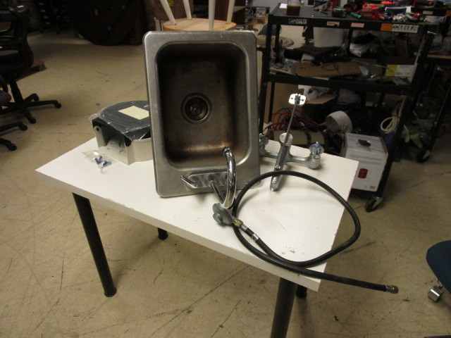 lot 320 image: NSF SINK, FAUCET, NEW TOILET PAPER DISPENSER AND LP GAS REGULATOR