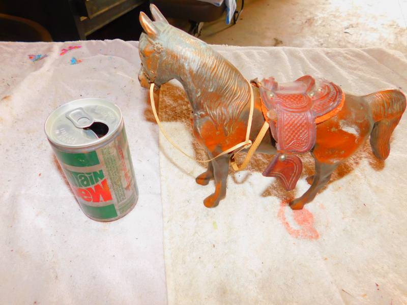 lot 74 image: Vintage Mountain Dew Can And A Brass Horse