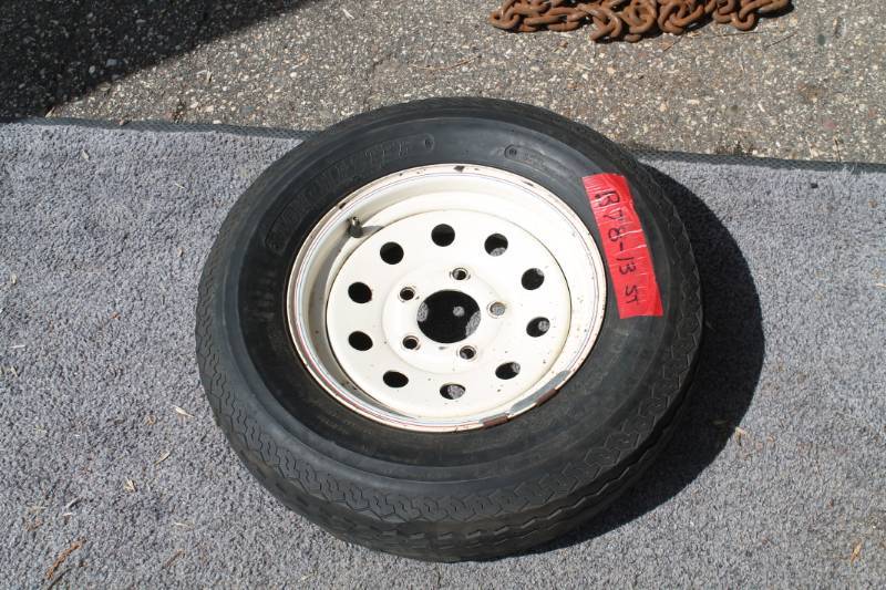 lot 87 image: B 78 X 13 5 Hole Rim And Tire OK For Spare
