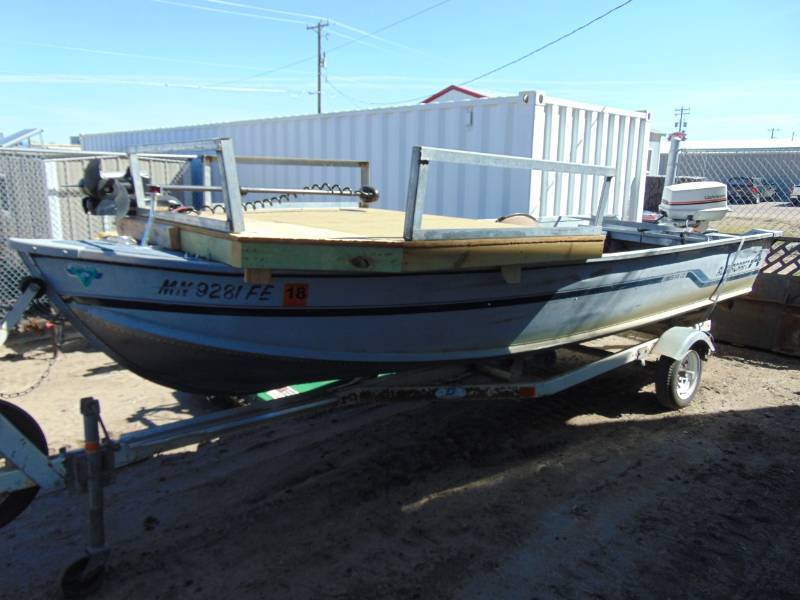 lot 1 image: 1988 16 Alumacraft Fishing Boat W35 HP Johnson and Shoreline Roller Trailer