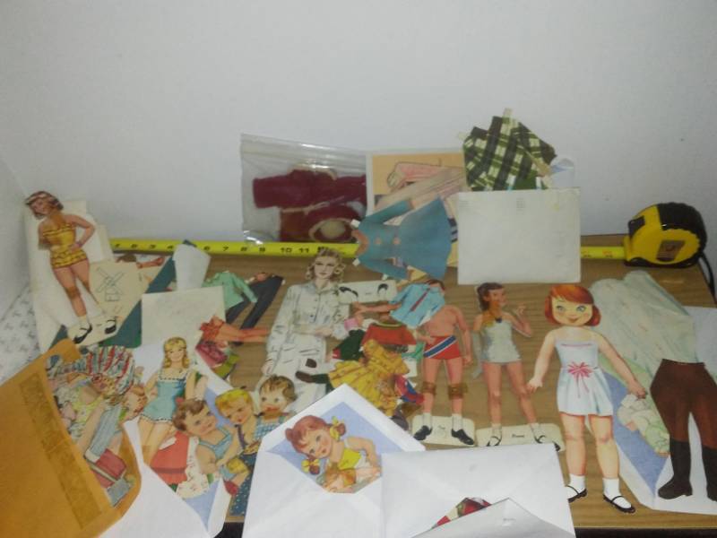 lot 60 image: Large paper doll cut out lot.