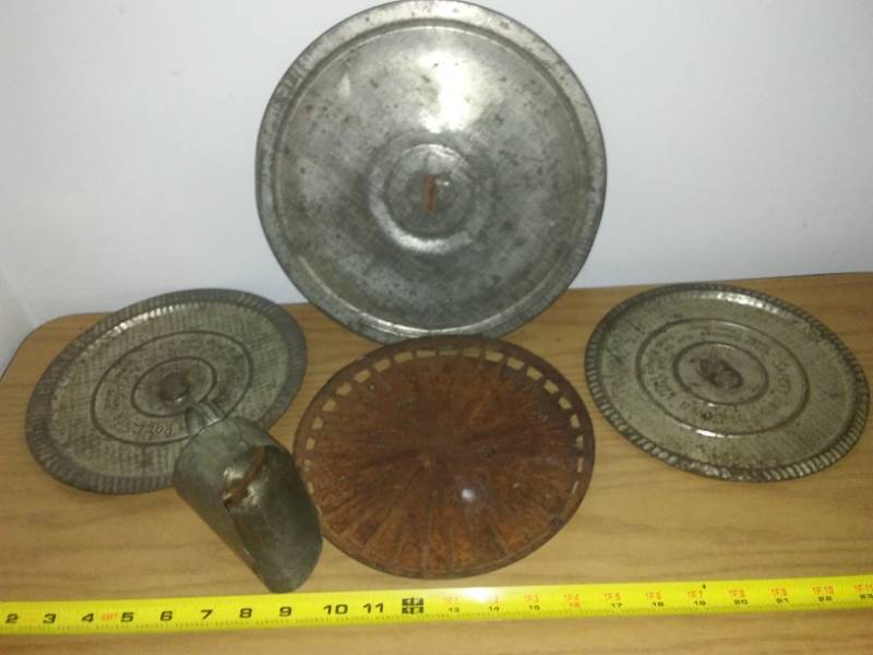 lot 65 image: Vintage pot covers, scoop and cast.