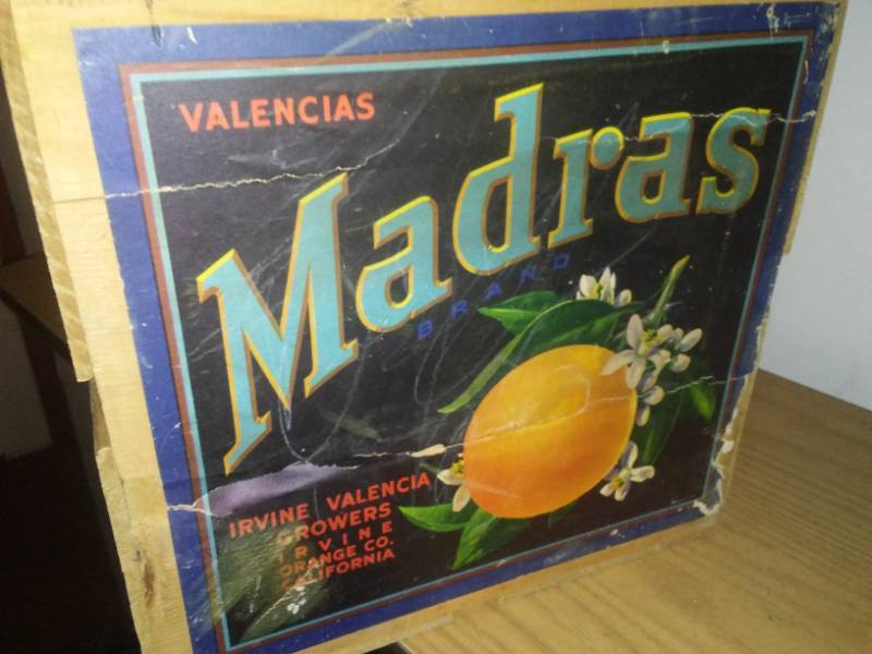 lot 90 image: Double sized wood Madras orange crate.