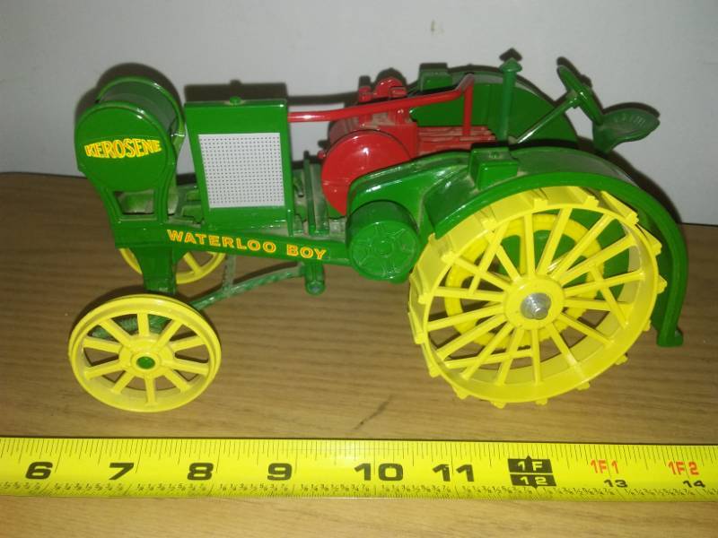 lot 108 image: Waterloo boy kerosene steel wide wheel.