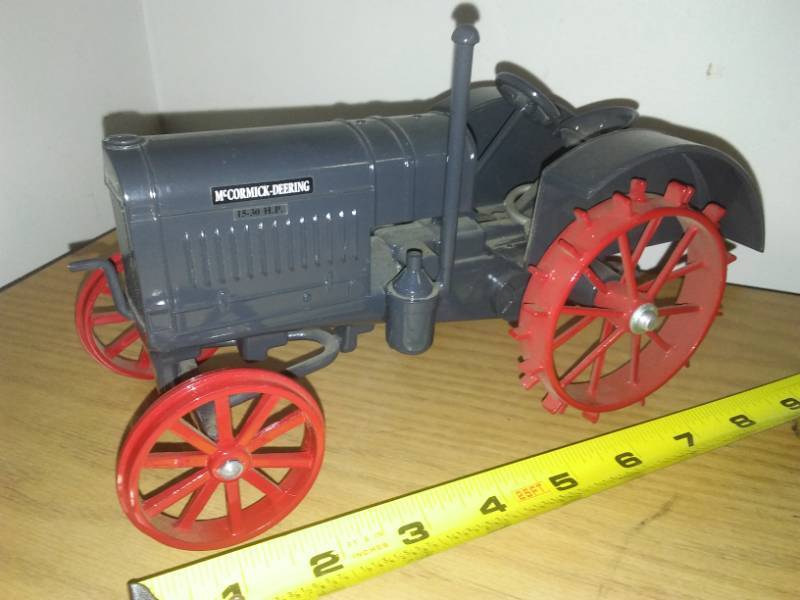 lot 124 image: McCormick - Deering tractor steel wheel.