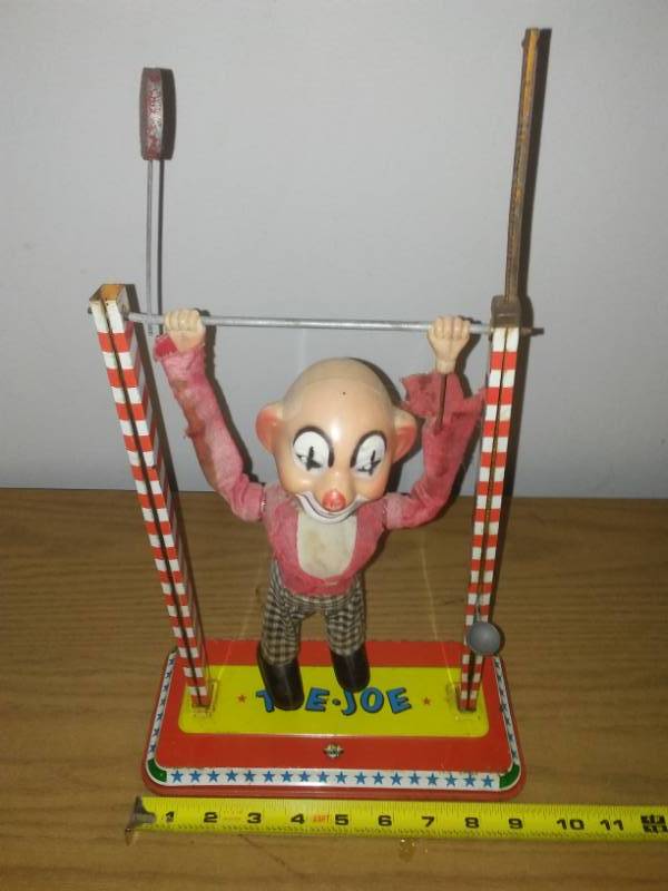 lot 177 image: Toe Joe tin metal acrobat clown  Ohio art