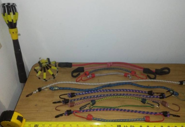 lot 196 image: 13 bungee cords and light bulb extension tool