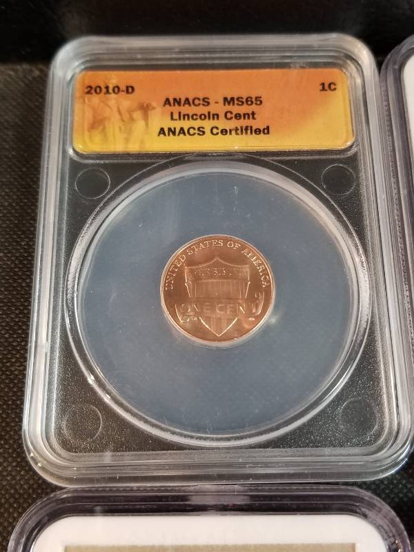 GROUP OF 4 CERTIFIED COINS INCLUDING A SAMPLE SLAB