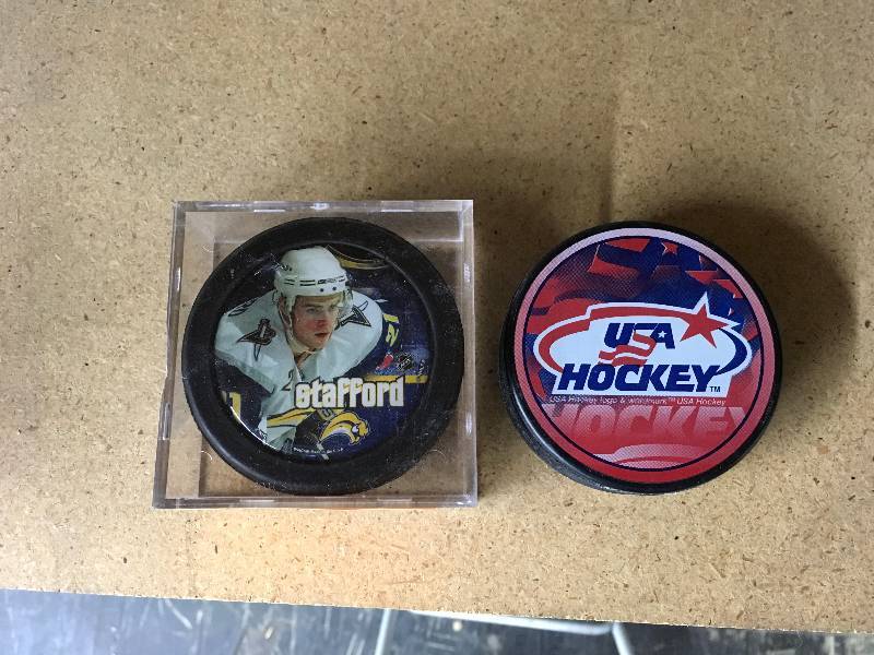 Drew Stafford & USA Hockey Pucks