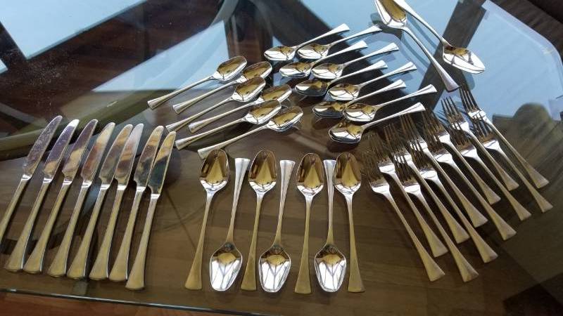 lot 136 image: International Stainless Flatware Service with Exaggerated Knife Rests