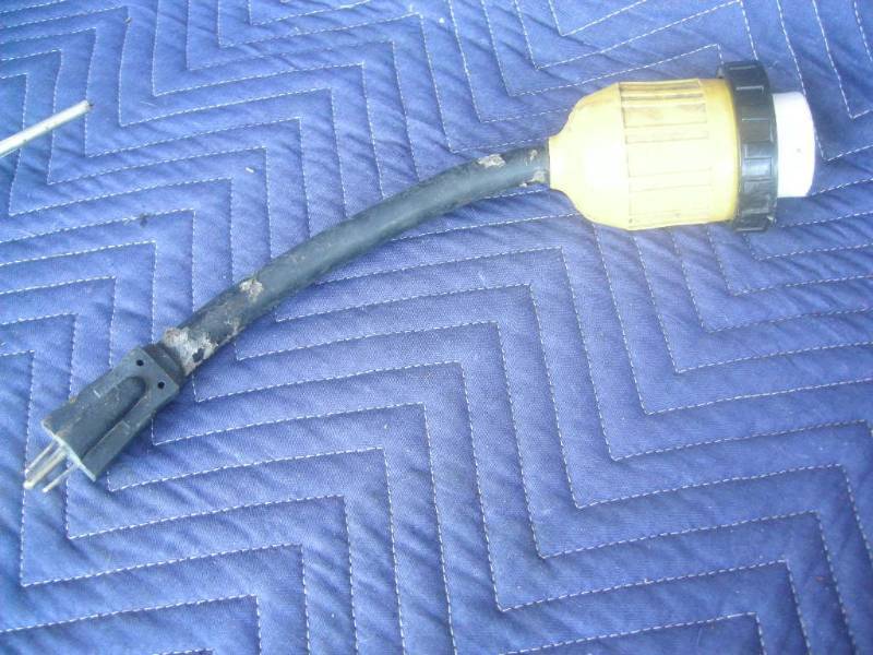 lot 49 image: RV 30Amp - 15Amp Adapter