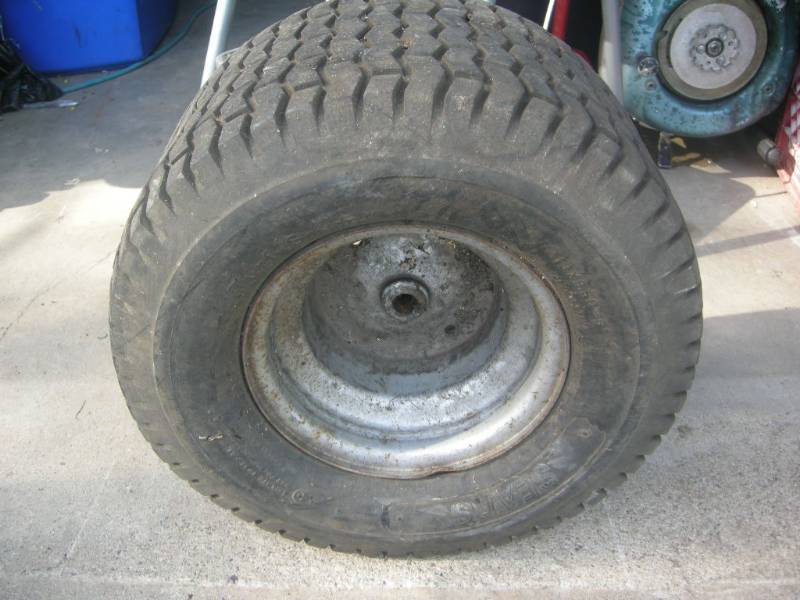 lot 97 image: Sears Turf-Saver Tire on Rim
