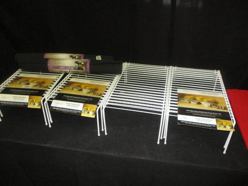 lot 87 image: 4 Large Cabinet Expanding shelves and 2 rolls of rubber shelf liner