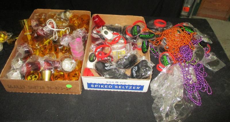 lot 117 image: Shot Glasses, Mardi Gra Necklaces and misc and milk basket
