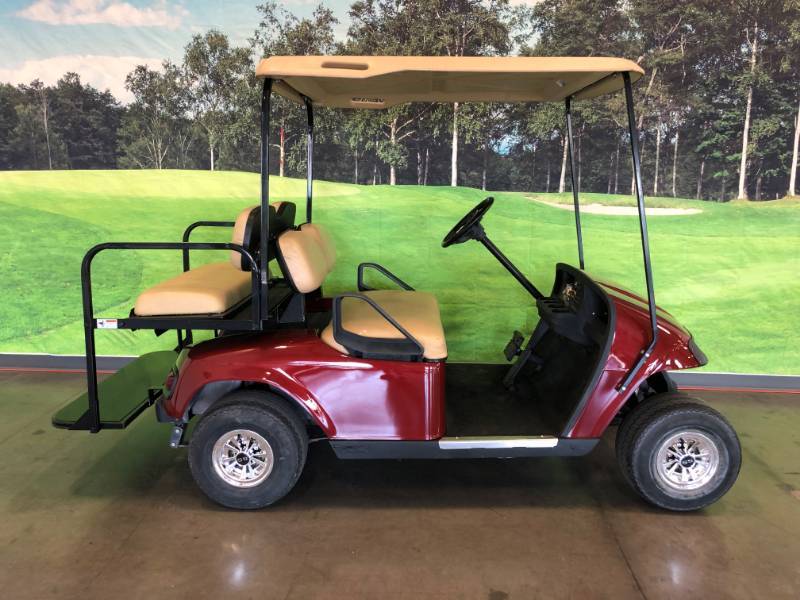 lot 103 image: Burgundy 4 Passenger EZ-GO TXT Golf Cart