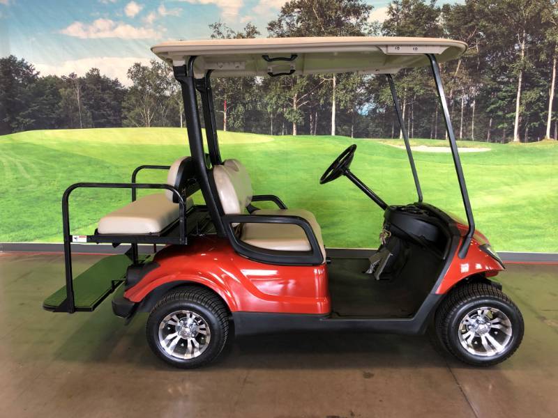 lot 106 image: Corvette Orange Metallic Gas Yamaha 4 Passenger Golf Cart