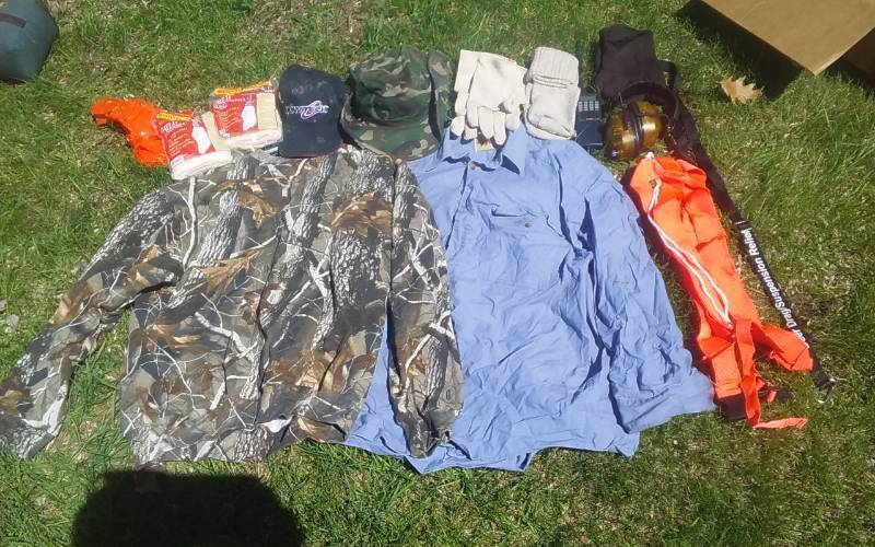lot 15 image: Assorted Hunting Gear-Shirts, Hats, Gloves, Deer Drags