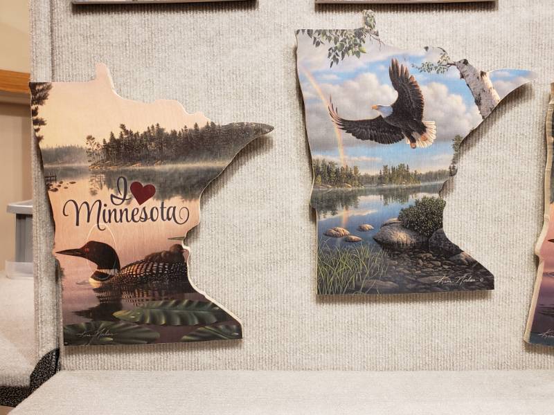 lot 149 image: (6) Kim Norlien Prints on Wood Minnesota Shaped with Encouraging and Spiritual Quotes - 8 x 12 Each