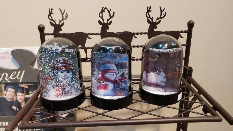 lot 176 image: A Wonderful Group of Christmas Decor  Kim Norlien Artwork and More