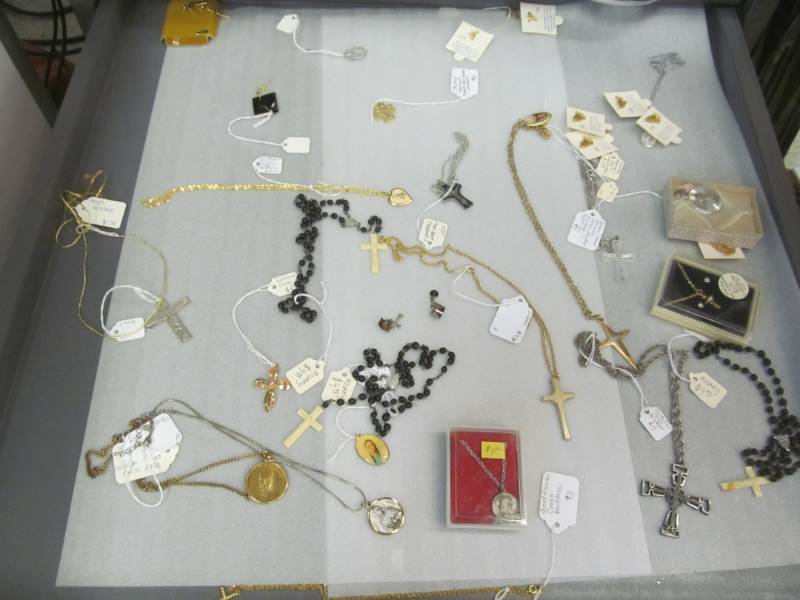 lot 98 image: Assortment of Jewelry ( Rosarys, Pins, Tiger eye earrings)