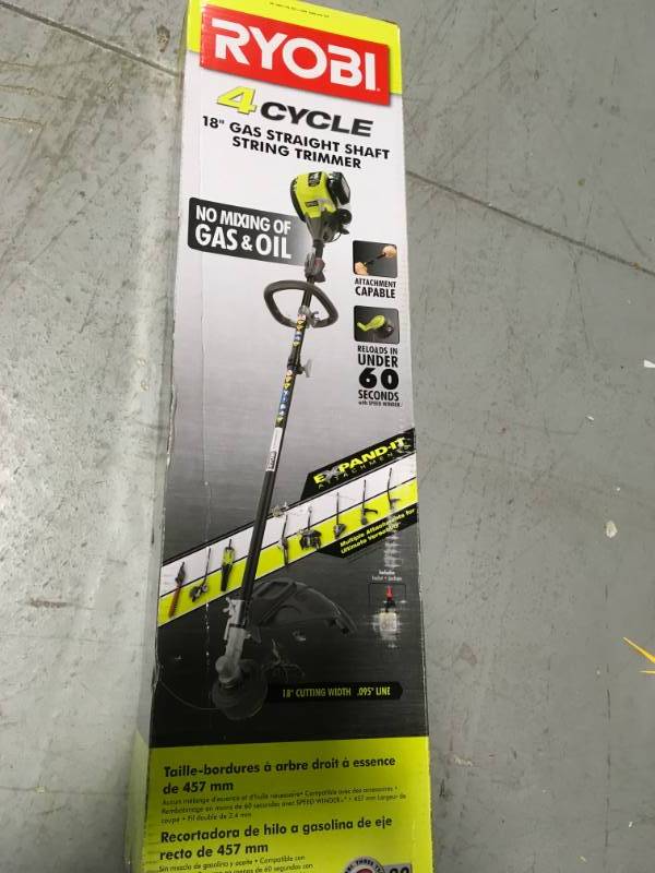 lot 23 image: RYOBI 4-Cycle 30cc Attachment Capable Straight Shaft Gas Trimmer in good condition