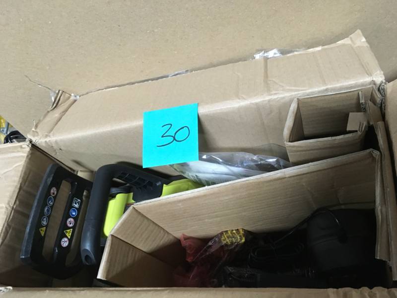 lot 30 image: RYOBI ONE 12 in. 18-Volt Brushless Lithium-Ion Electric Cordless Chainsaw - 4.0 Ah Battery and Charger Included  in good condition