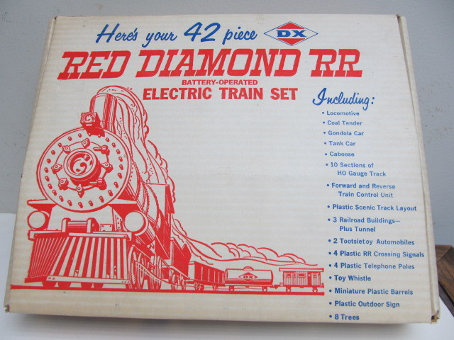 lot 57 image: Vintage DX Motor Oil Advertising Toy Train Set wBox