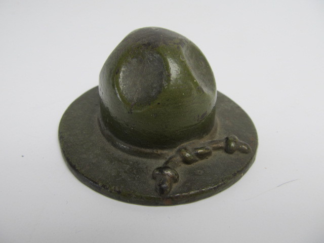 lot 36 image: Antique Cast Iron Ranger Hat Paperweight