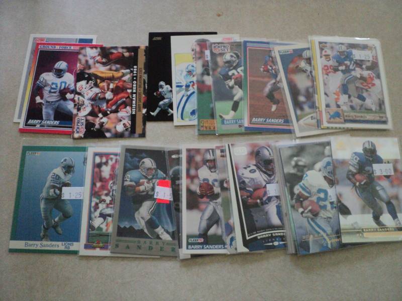 lot 112 image: 25 Barry Sanders Cards...
