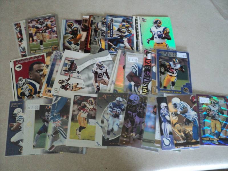 lot 127 image: 40 Marshall Faulk Cards...