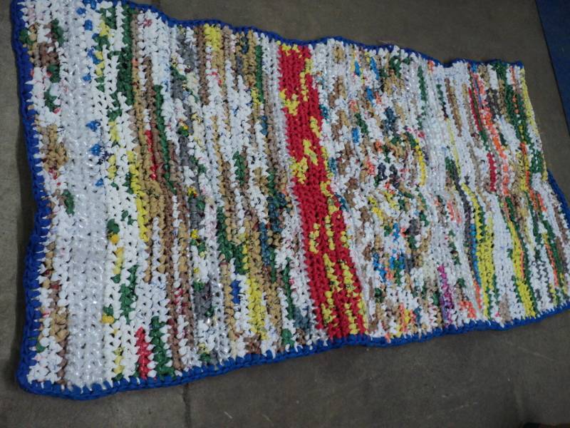lot 326 image: 32 x 66 Plastic Rug...
