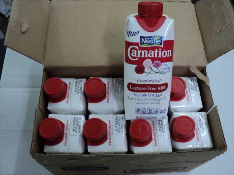 lot 386 image: Case of 8 Nestle Carnation Evaporat...
