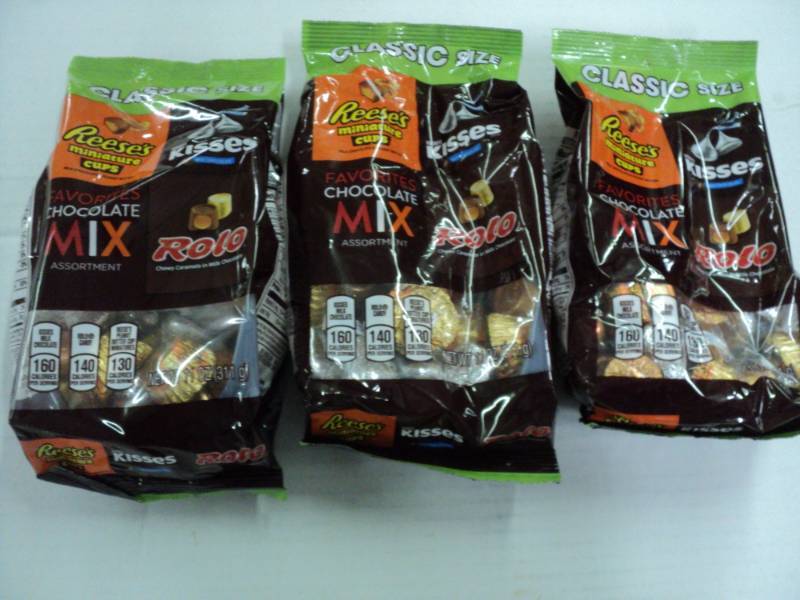 lot 410 image: 3 Bags Reeses Rollos and Kisses...