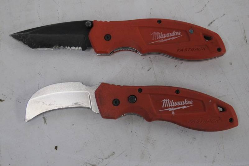 lot 25 image: Set of 2 Milwaukee Fastback Knives -  Serrated Utility Knife  Hawk Bill Flip Knife