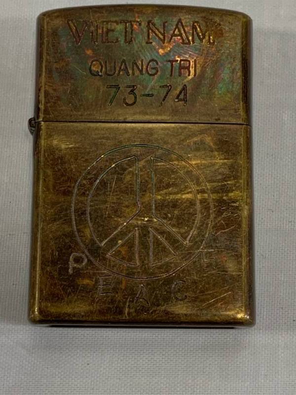 lot 11 image: Vietnam Hand Carved Zippo Lighter