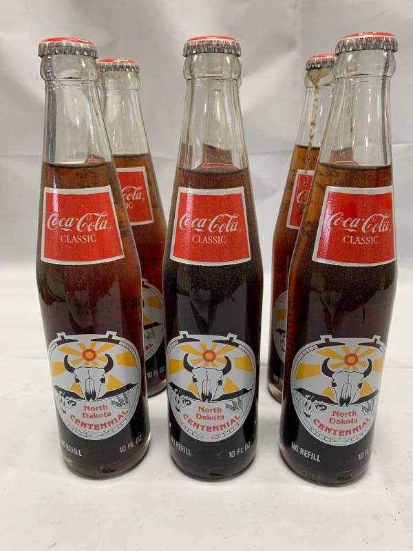 lot 50 image: Lot of 6 Coca Cola North Dakota Centennial (30 years old)