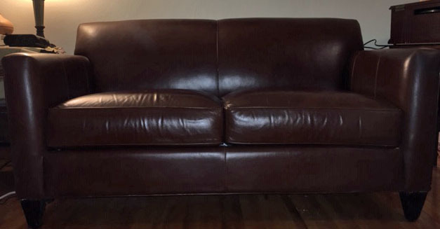 lot 45 image: Crate & Barrel Brown Leather Loveseat