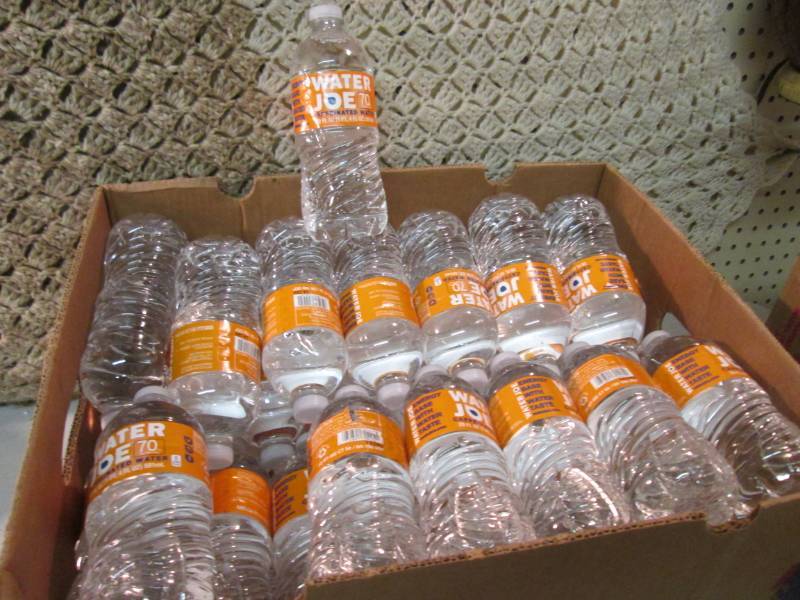lot 68 image: Banana Box Full of 20 ounce Bottles...