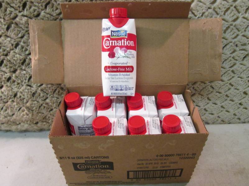 lot 174 image: Case of 8 Nestle Carnation Evaporat...