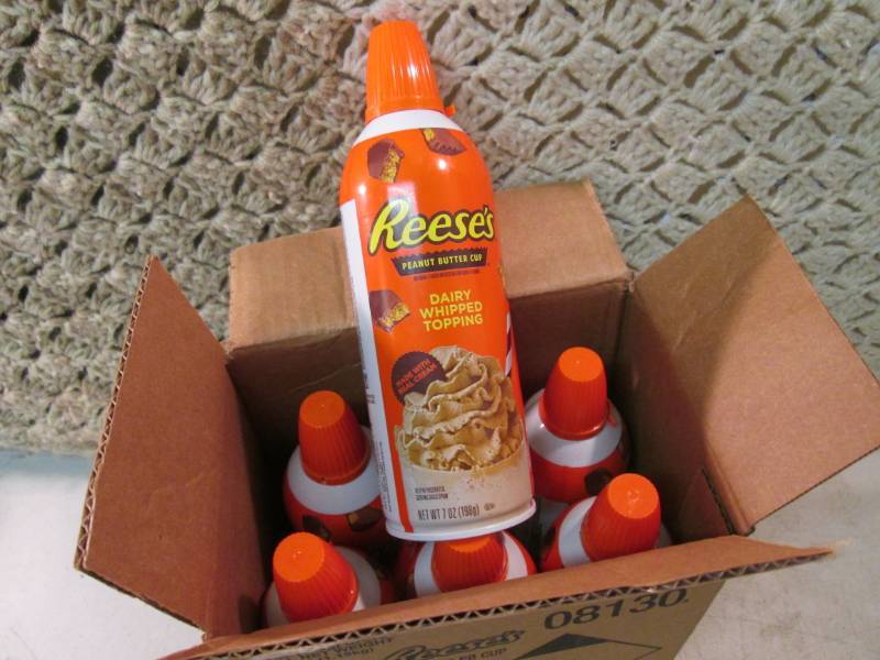 lot 214 image: Case of 6 Cans of Reeses Peanut But...