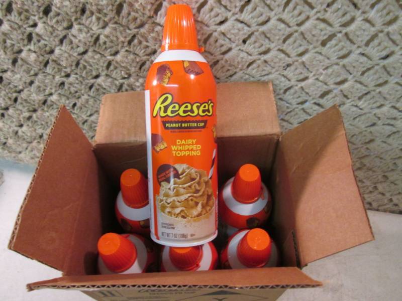 lot 216 image: Case of 6 Cans of Reeses Peanut But...