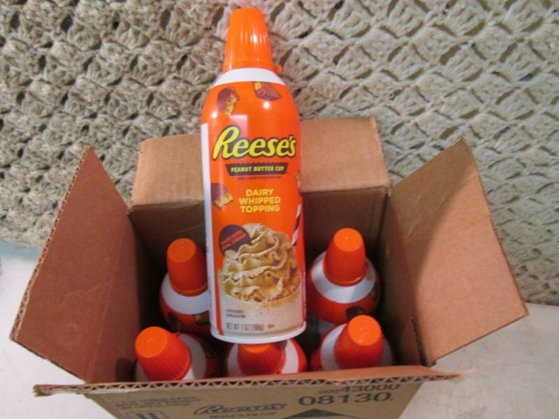 lot 217 image: Case of 6 Cans of Reeses Peanut But...