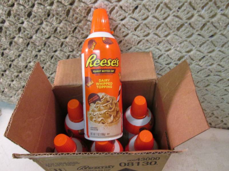lot 218 image: Case of 6 Cans of Reeses Peanut But...