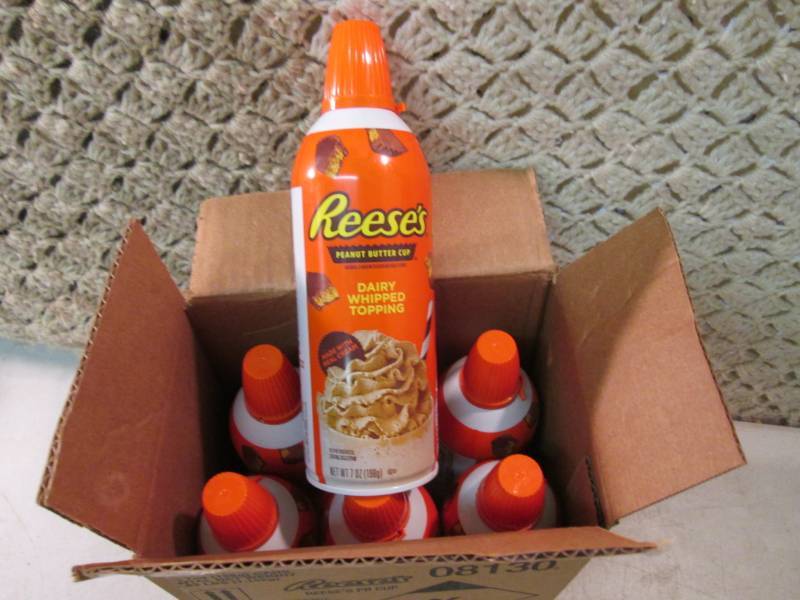 lot 219 image: Case of 6 Cans of Reeses Peanut But...