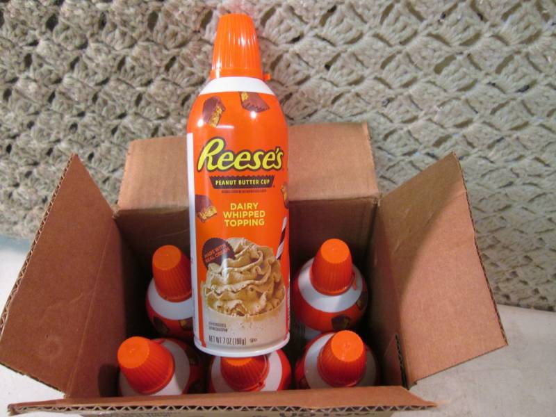 lot 220 image: Case of 6 Cans of Reeses Peanut But...