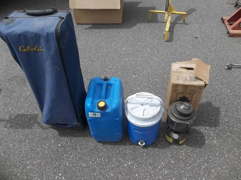 lot 9 image: Cabelas Folding Air Bed Frame With Rolling Case, Water Jugs, Cooler, Lantern