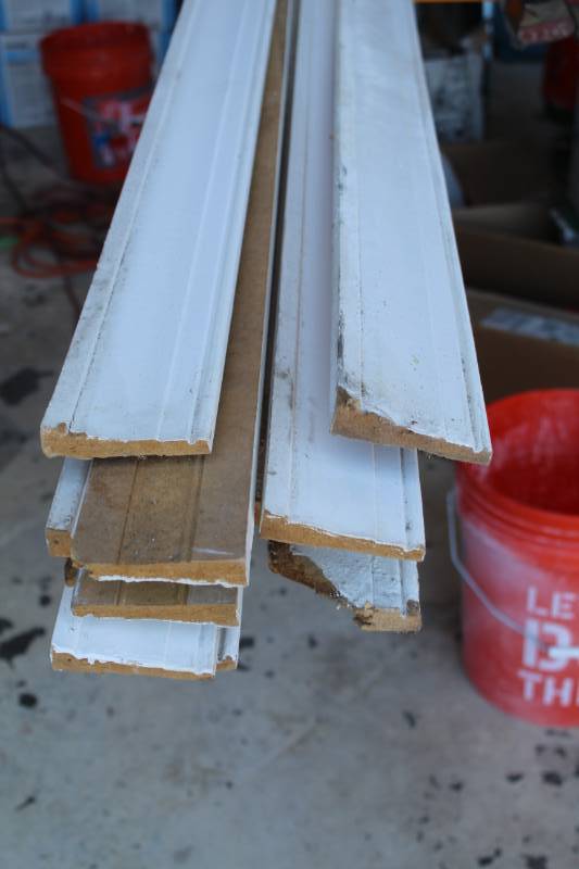lot 195 image: Lot of (11) 16ft. Wood Baseboards
