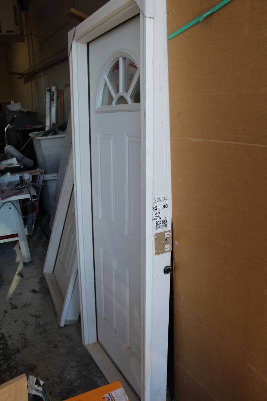 lot 30 image: Primed Steel Fan Lite Clear Tempered Glass Front Entry Door